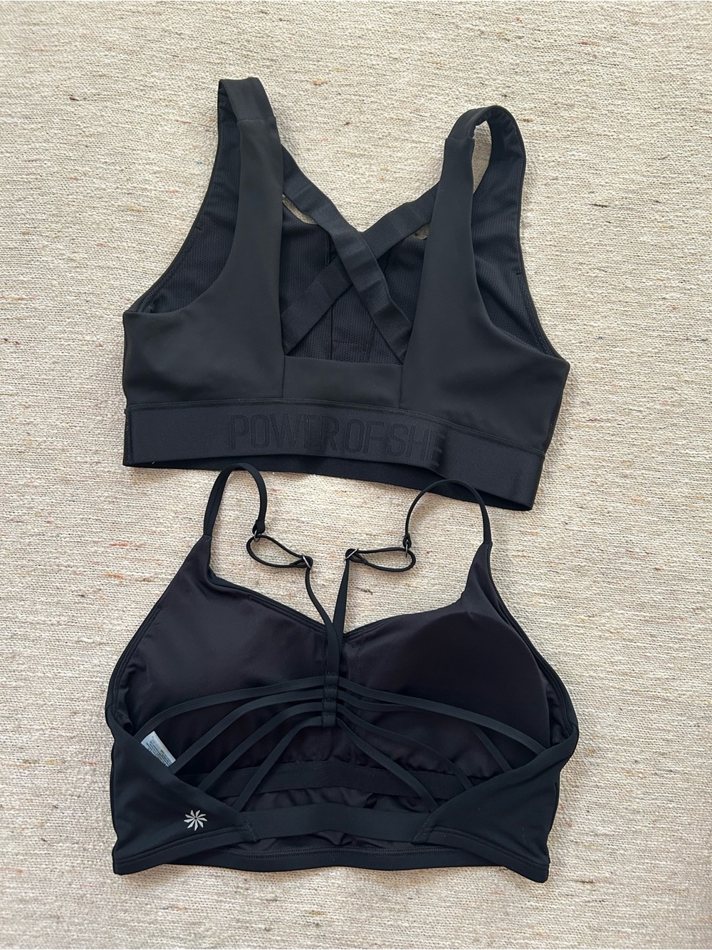 Athleta Sports Bra - two! One is POWER OF SHE collection. Like new!